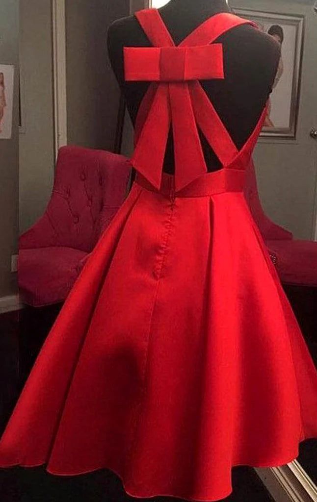 Back view of an ankle-length deep V-neck formal dress.