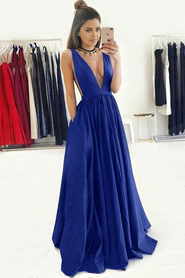 Royal blue A-line formal dress with deep V-neck, ruched bodice, and sweep train.