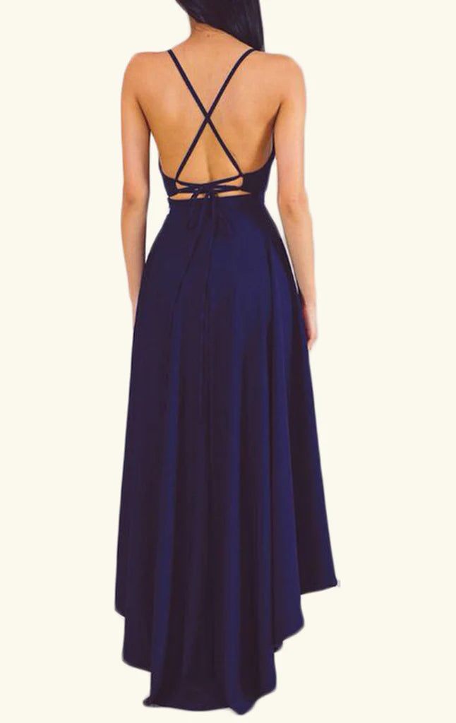 Woman posing in a deep V-neck formal maxi gown.