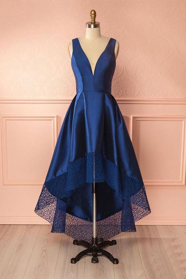 Woman wearing an elegant deep V-neck high-low lace and satin prom dress.