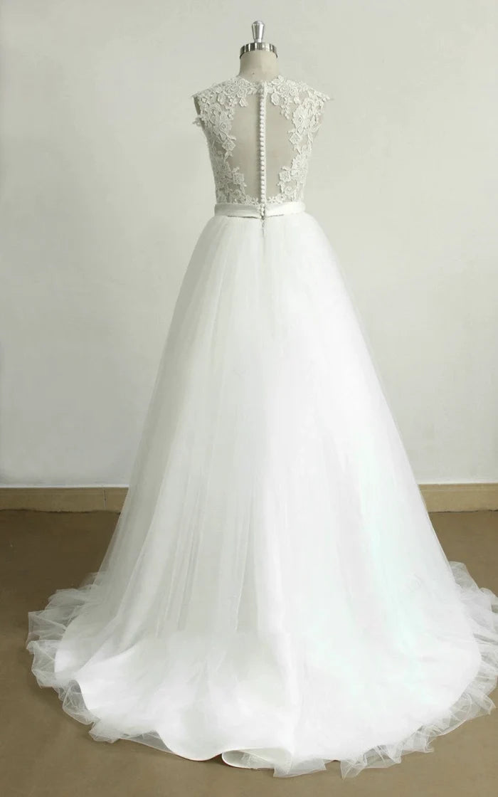 Back view of an A-line lace tulle wedding dress with delicate train.