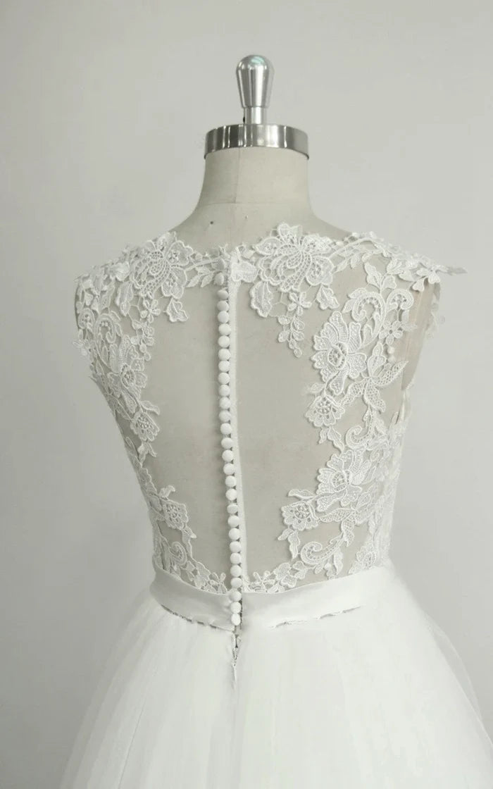 Close-up of the lace and tulle details on the A-line wedding dress.