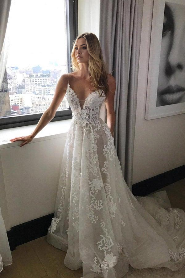 Elegant A-line beach wedding dress with deep V-neck.