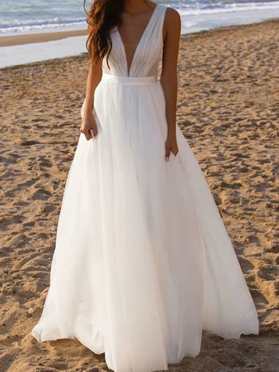 Model wearing an elegant A-Line deep V-neck tulle wedding dress.