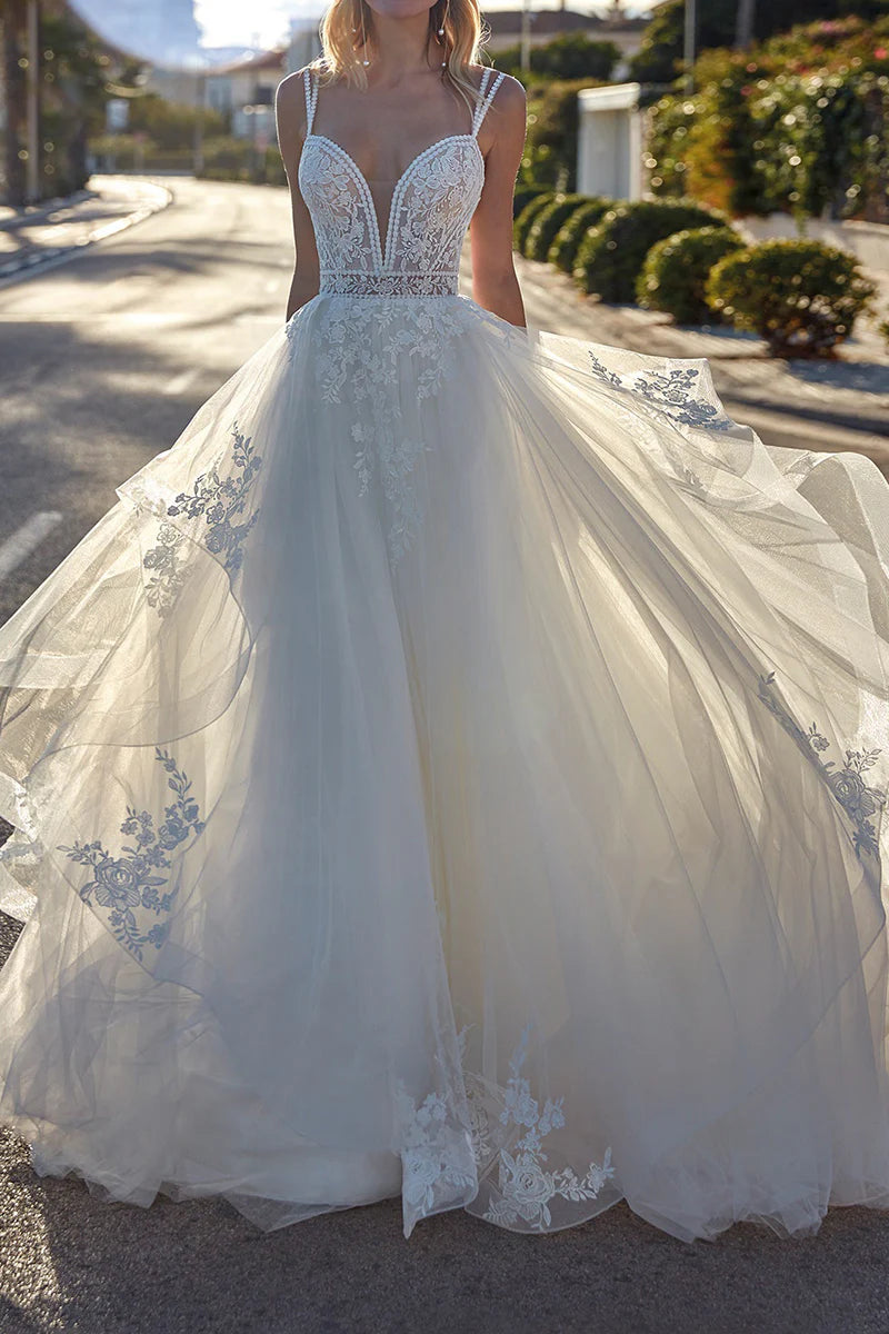 Elegant A-line deep V-neck wedding dress with lace appliques.