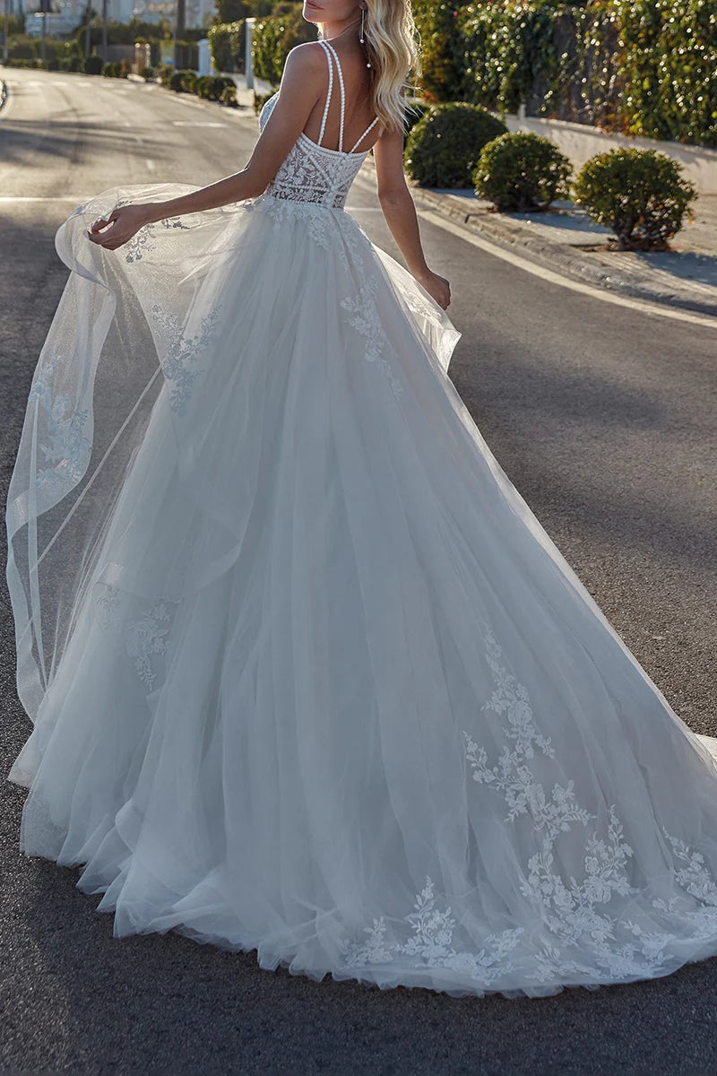 Back view of A-line wedding dress showcasing train and lace details.