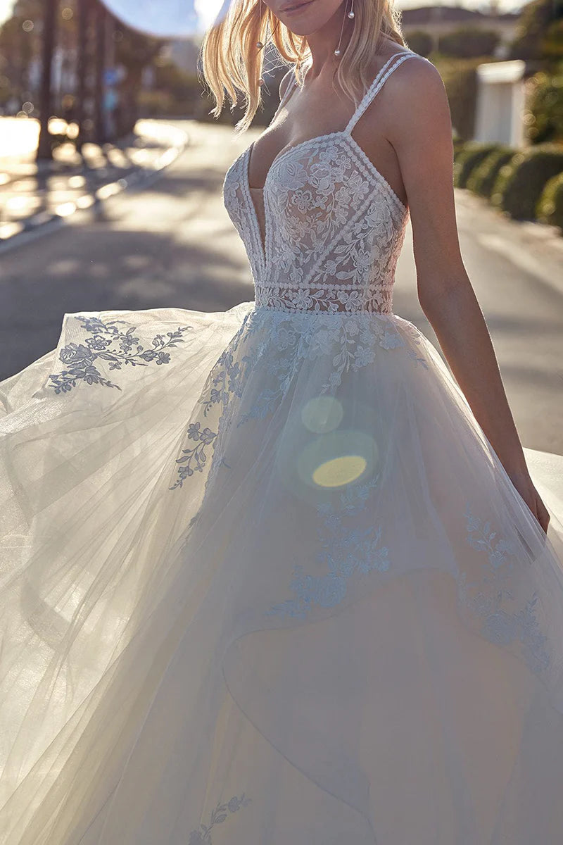 Close-up of delicate lace appliques on the A-line wedding dress.