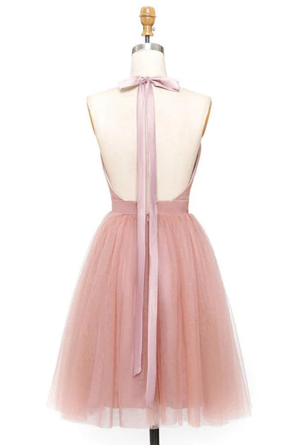 Side view of pink A-Line tulle mini dress, showing pleats.