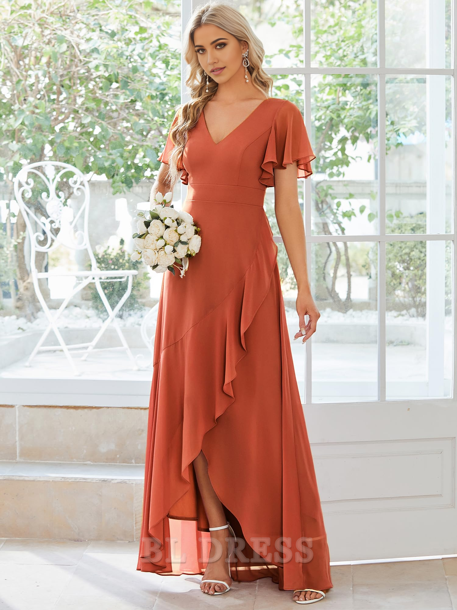 Elegant A-line chiffon high-low dress with double V-neck and ruffle hem.