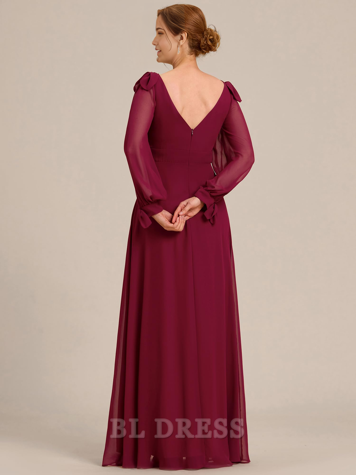 Back view of the long sleeve A-line formal gown.