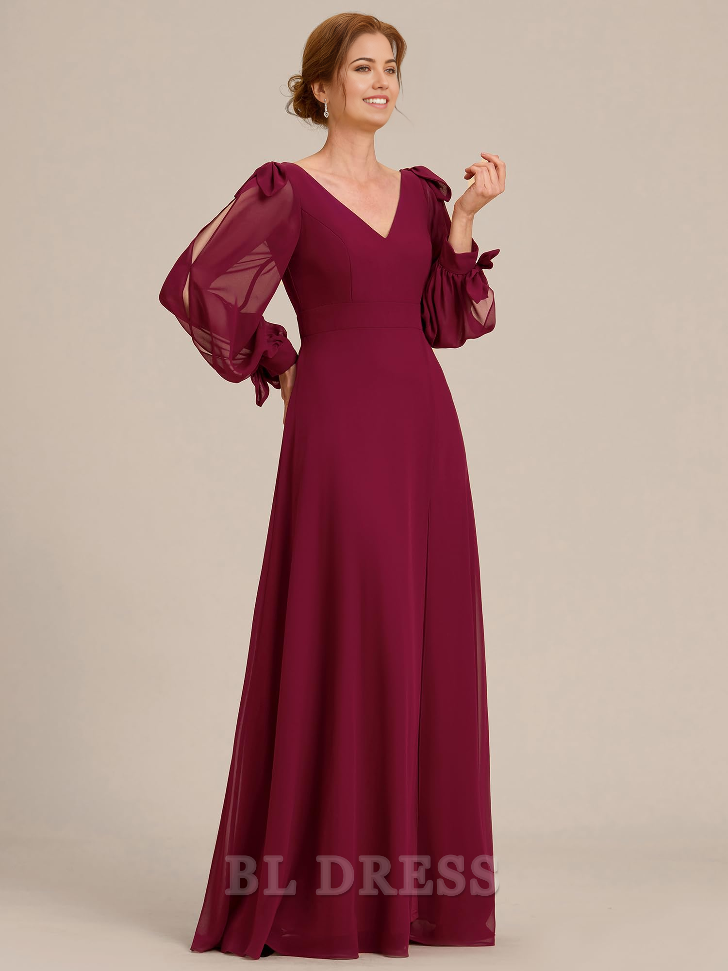Full length view of the elegant double V-neck evening gown.