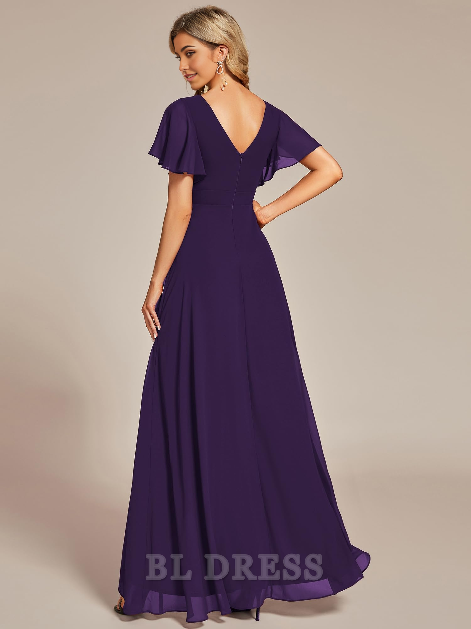 Back view of high-low chiffon dress showing ruffle and V-neck.
