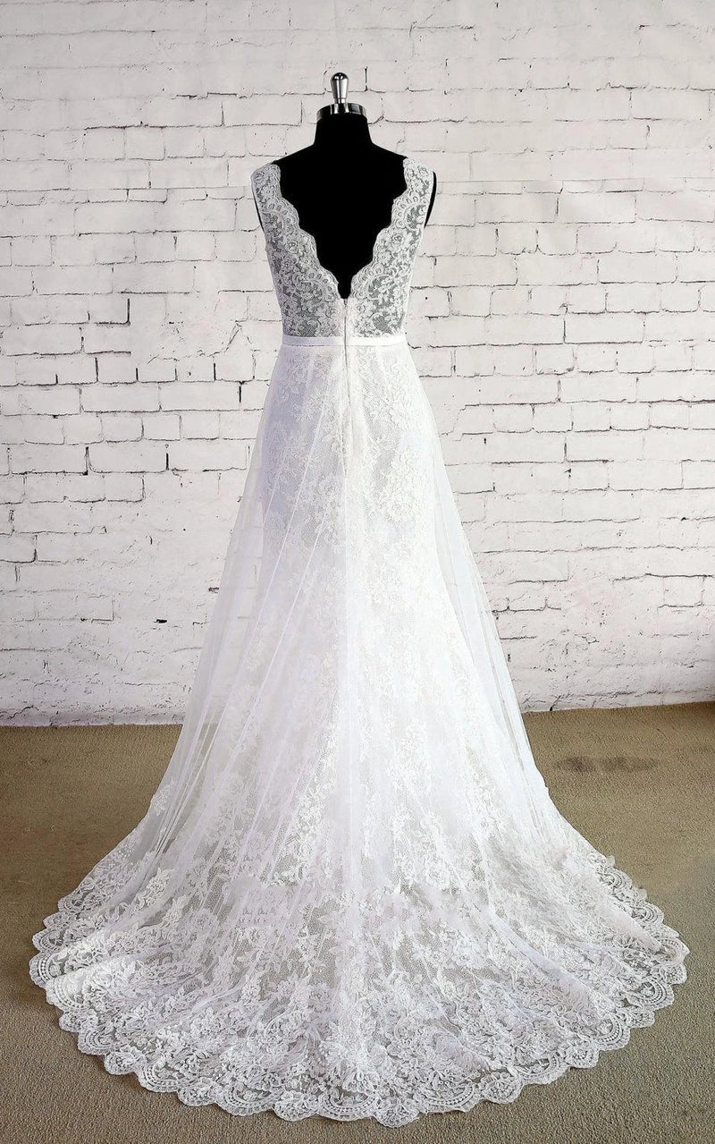 Elegant white lace wedding dress with double V-neck and A-line skirt.