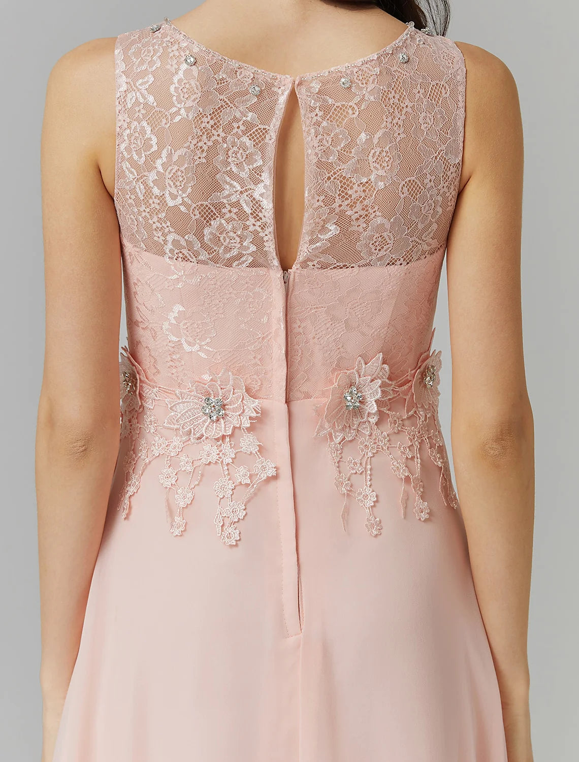 Close-up of beading appliques on the illusion neckline of the dress.
