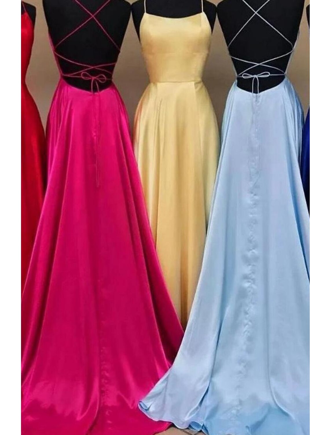 Back view of the charmeuse A-Line Empire gown featuring a backless design.