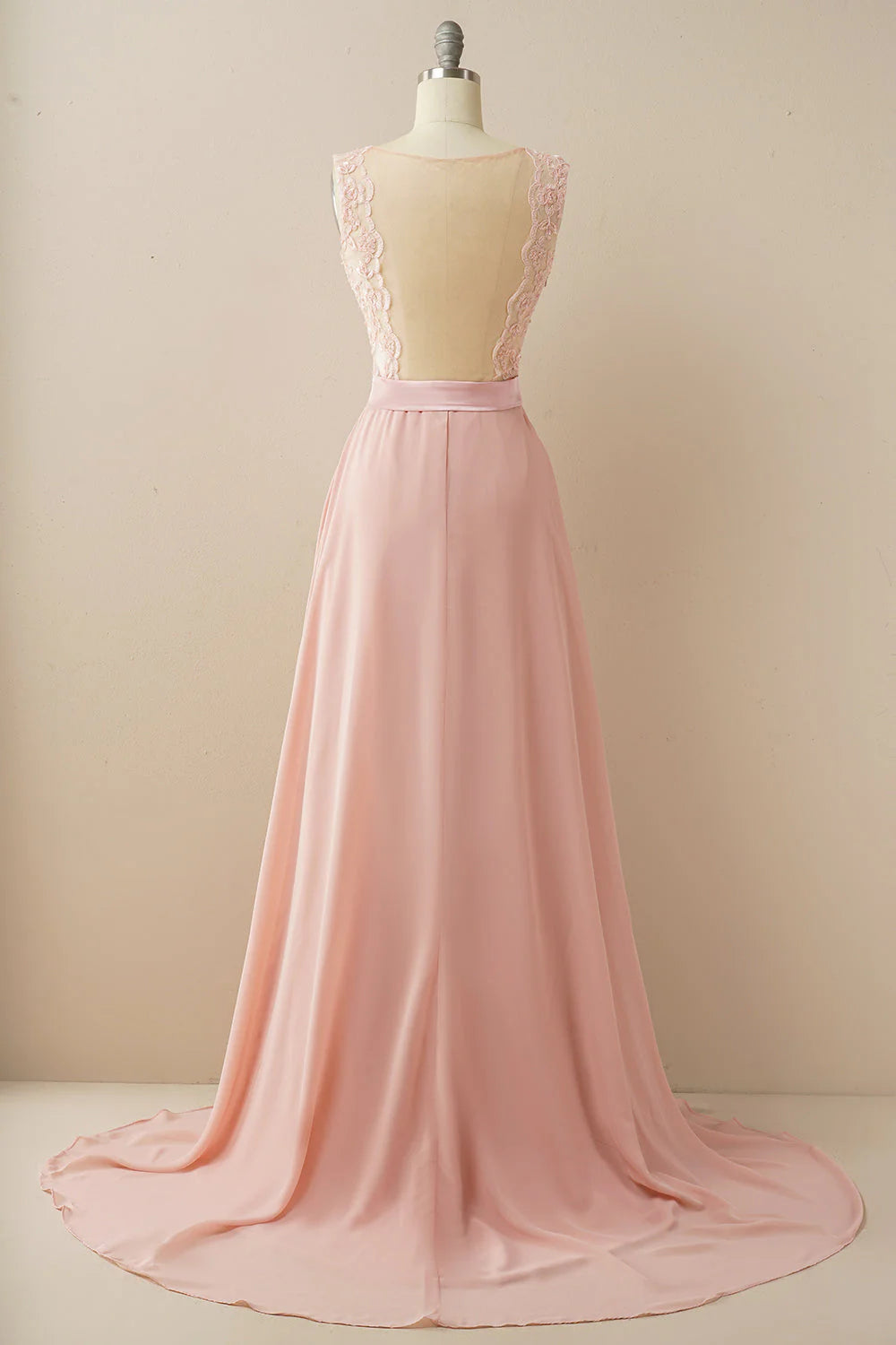 Close-up of the illusion neckline and beaded lace details on the A-line evening gown.