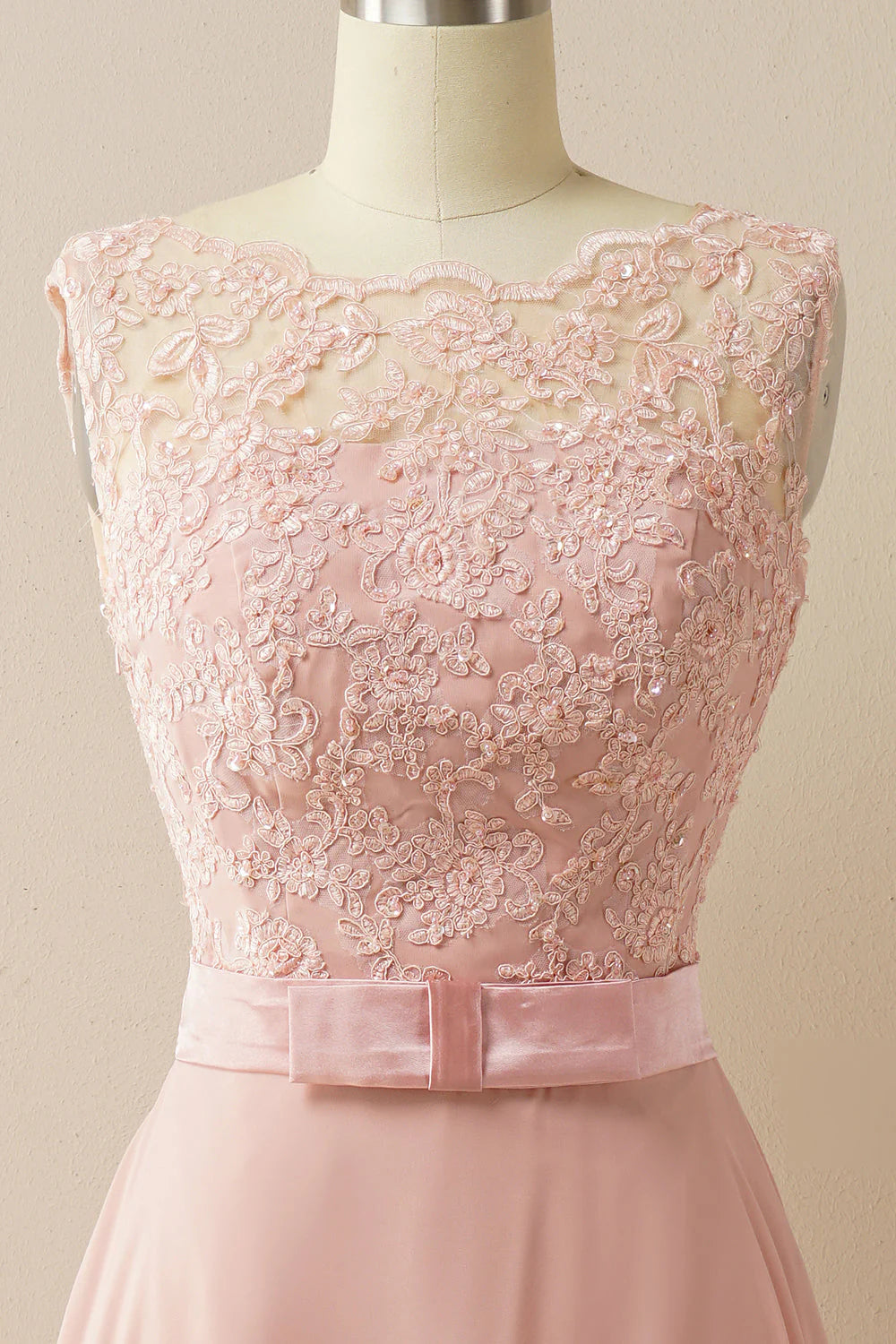 Back view of the A-line empire evening gown, showing the floor-length silhouette and appliques.