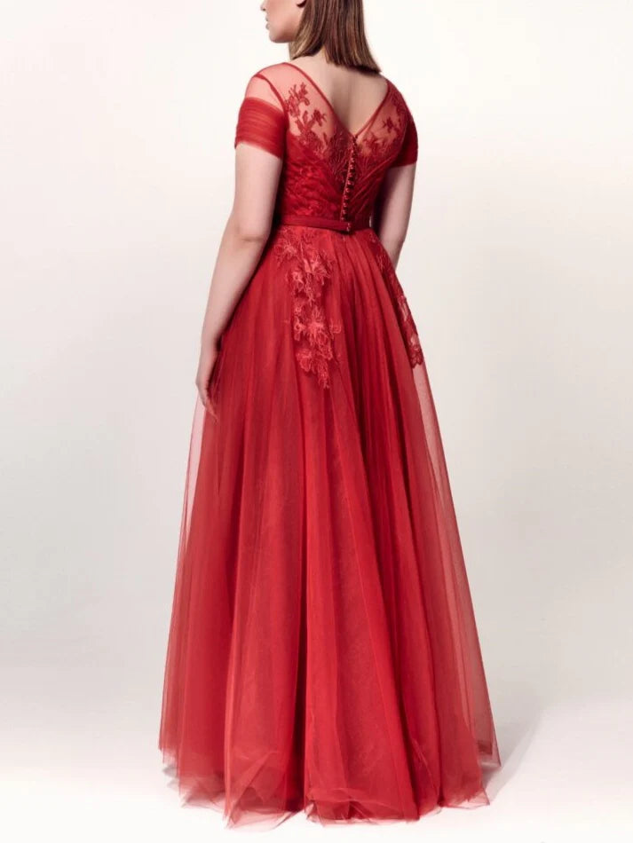 A-line formal gown with short sleeves, showcasing the silhouette.
