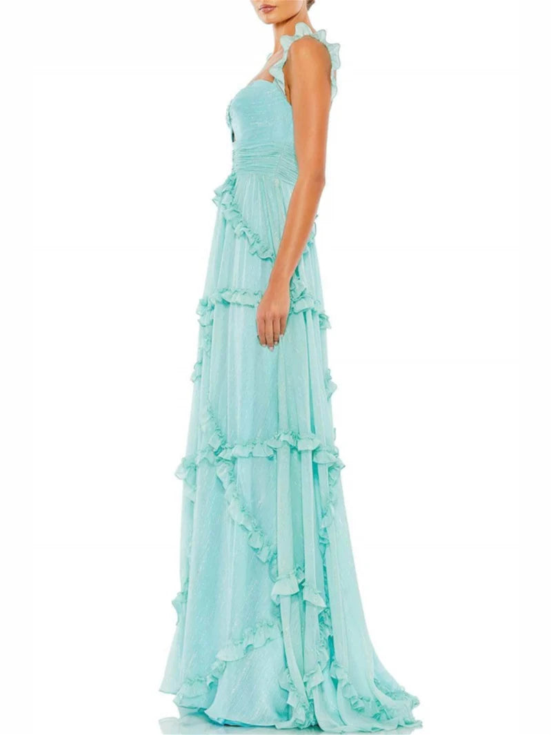 Close-up of the bodice and spaghetti straps of an A-line evening dress.