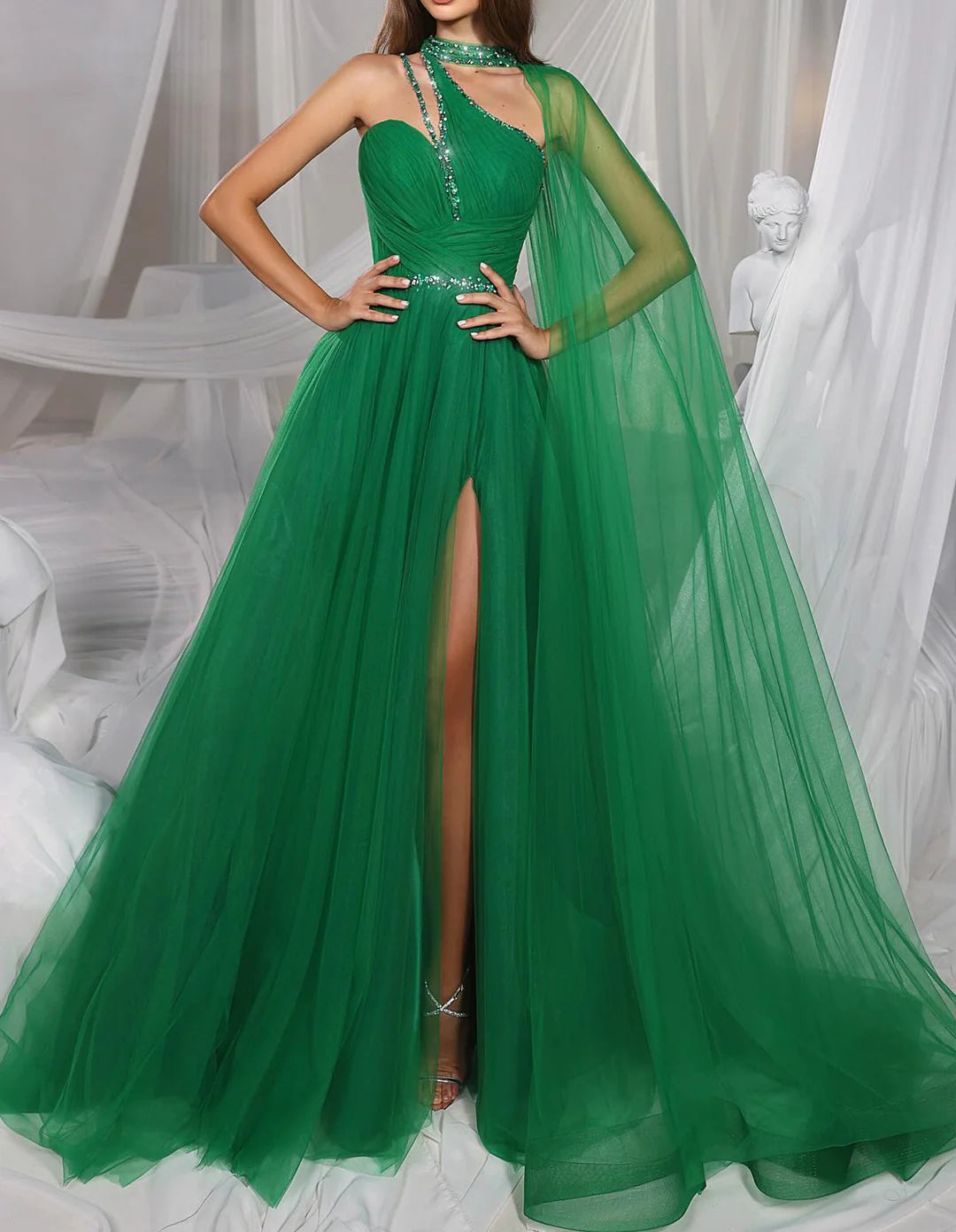 Model wearing an elegant A-line floor length sleeveless prom dress.