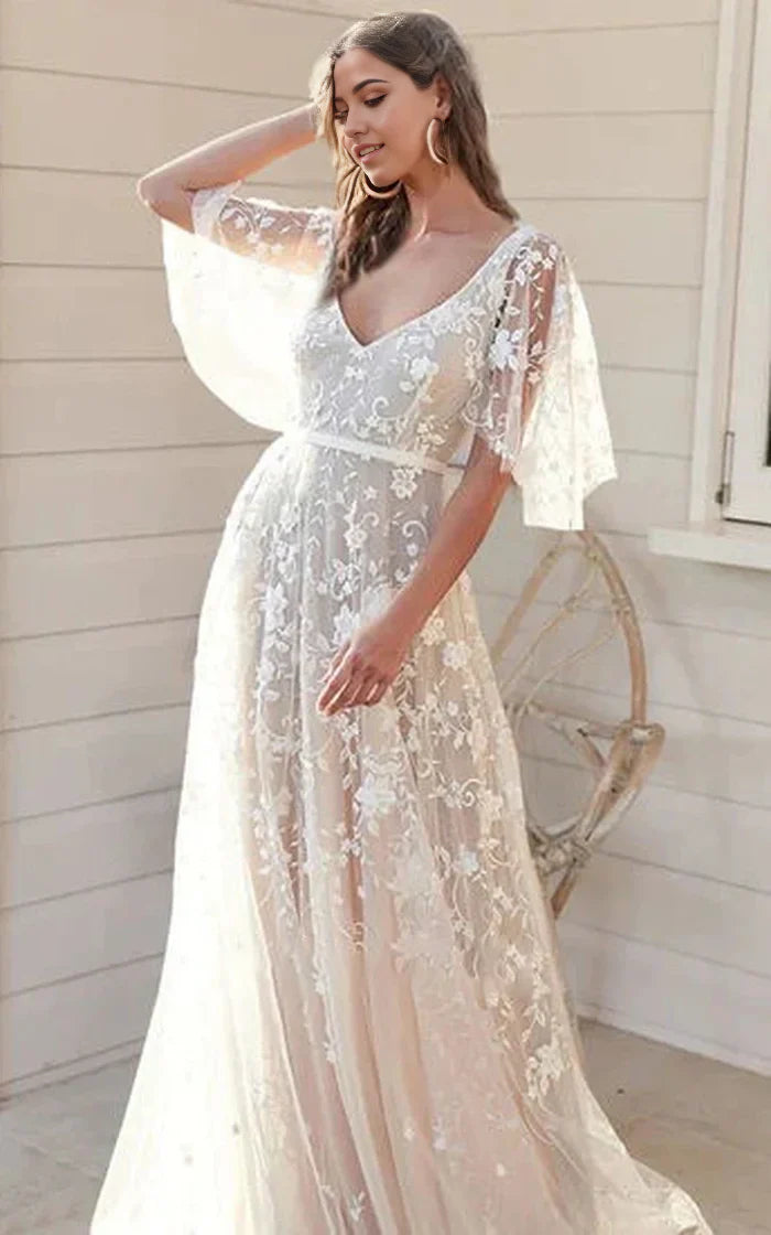 Elegant A-Line wedding dress with floral lace, short bell sleeves, and a deep V-back.