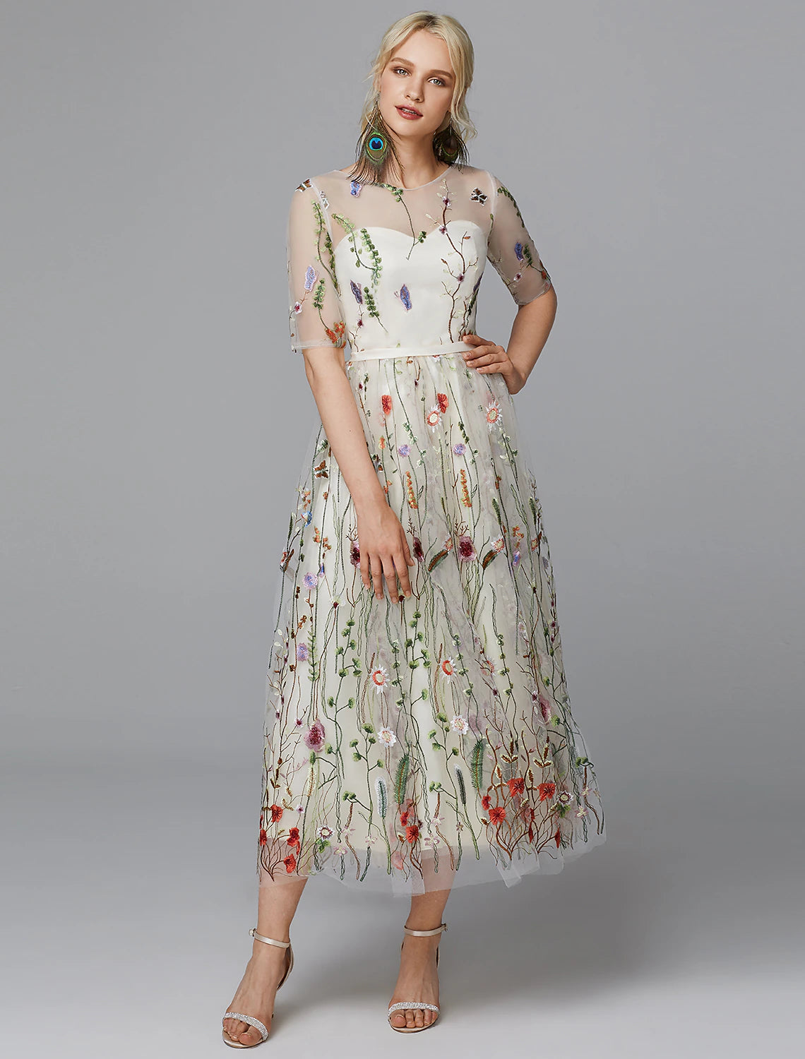 Elegant A-line floral lace tea length dress with illusion neckline.