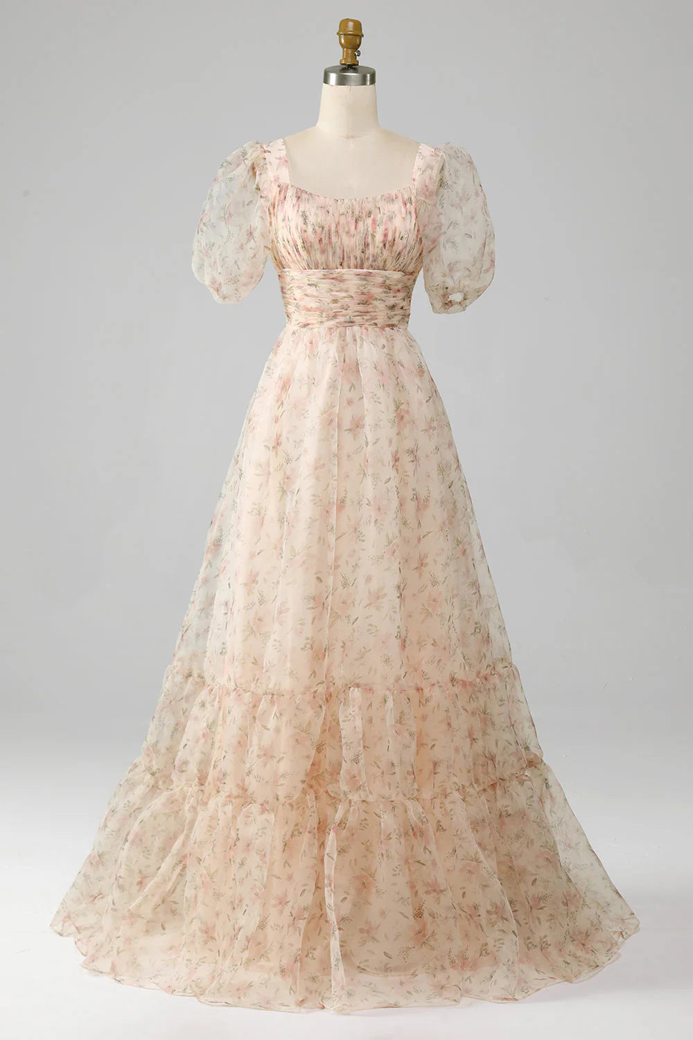 Model wearing an elegant A-Line floral print pleated tiered prom dress.