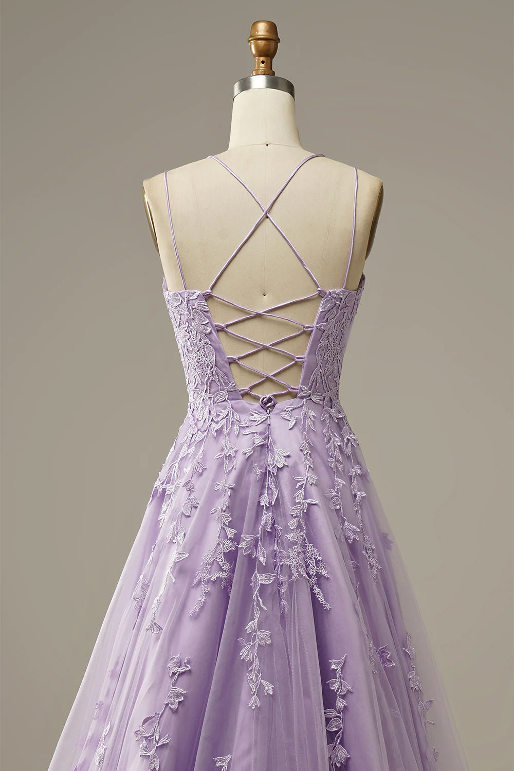 Side view of a model wearing a purple A-Line formal dress.