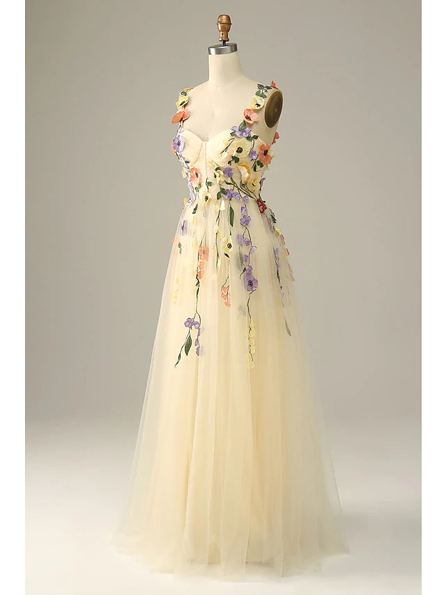 Back view of the A-line floral tulle dress with delicate appliques.