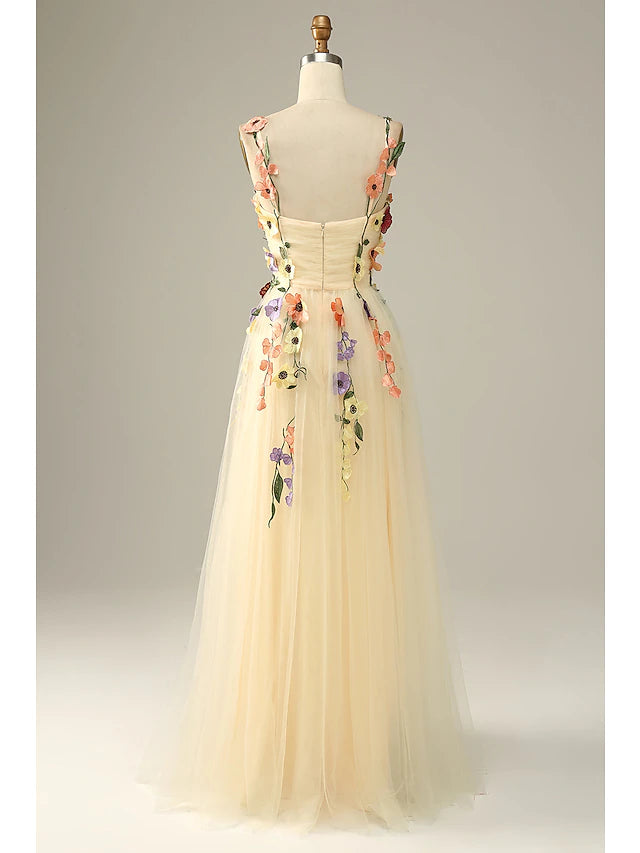 Close-up of floral appliques on the tulle fabric of the dress.
