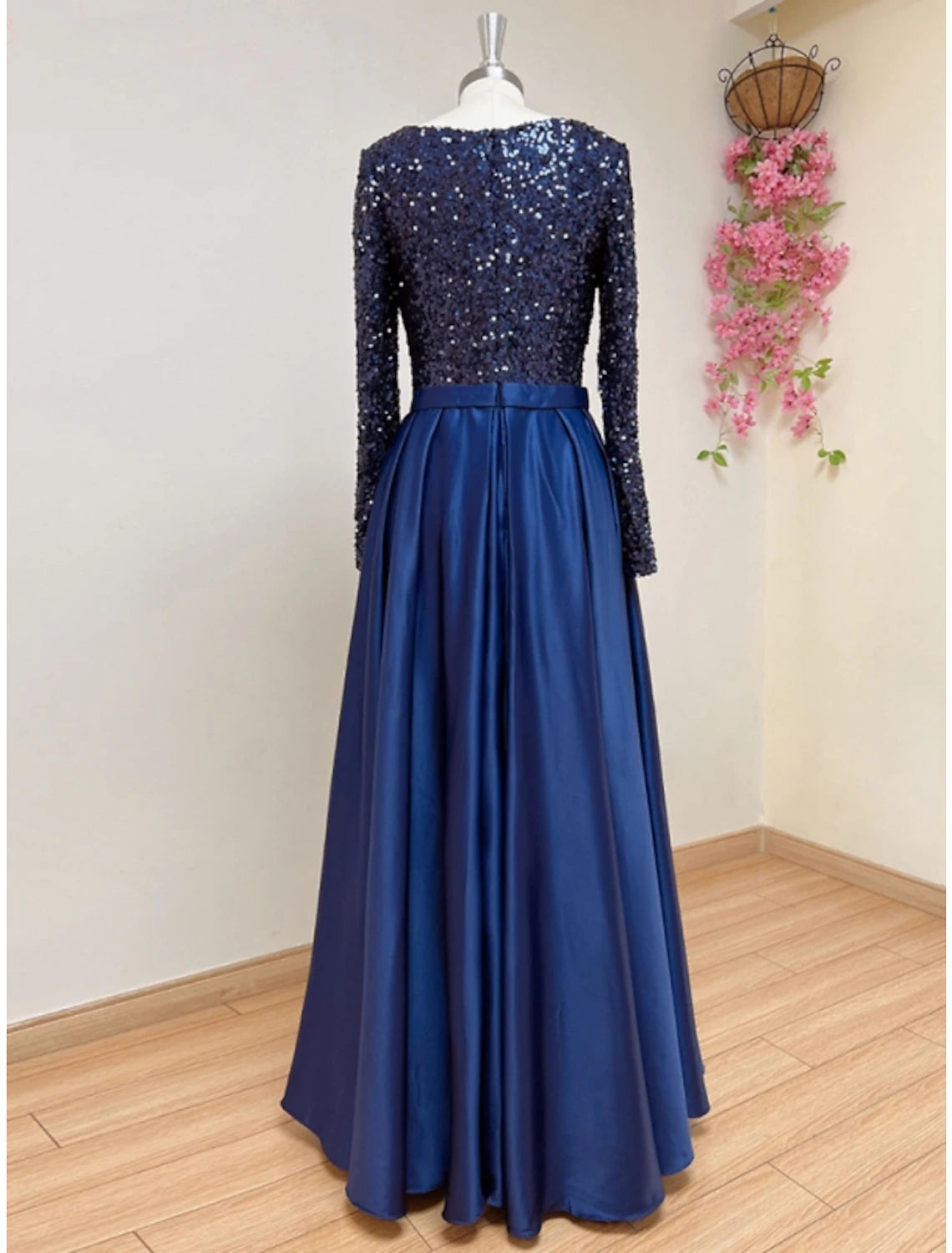 Back view of the A-line formal gown showing the sweep train.