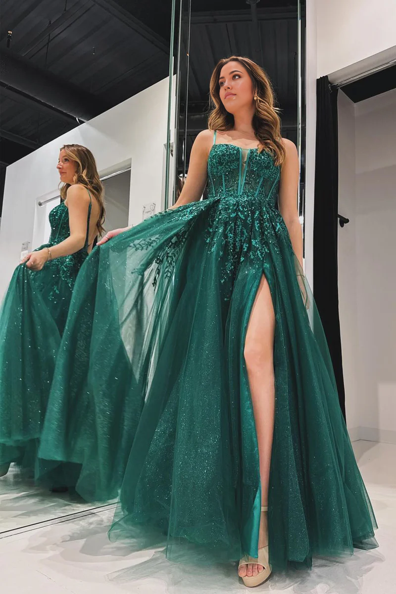 Elegant green A-line prom dress with spaghetti straps and appliques, front view.
