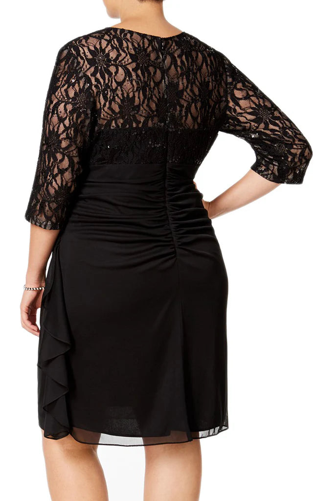 Woman in a formal ankle-length lace and chiffon gown with half sleeves.