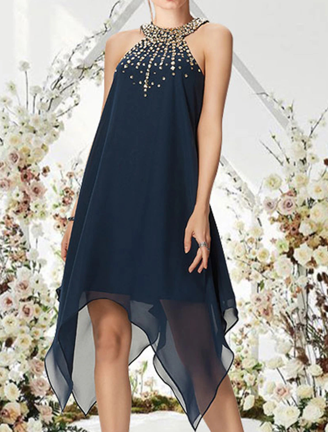 Side view of an A-line halter cocktail dress, highlighting chiffon fabric and beading.