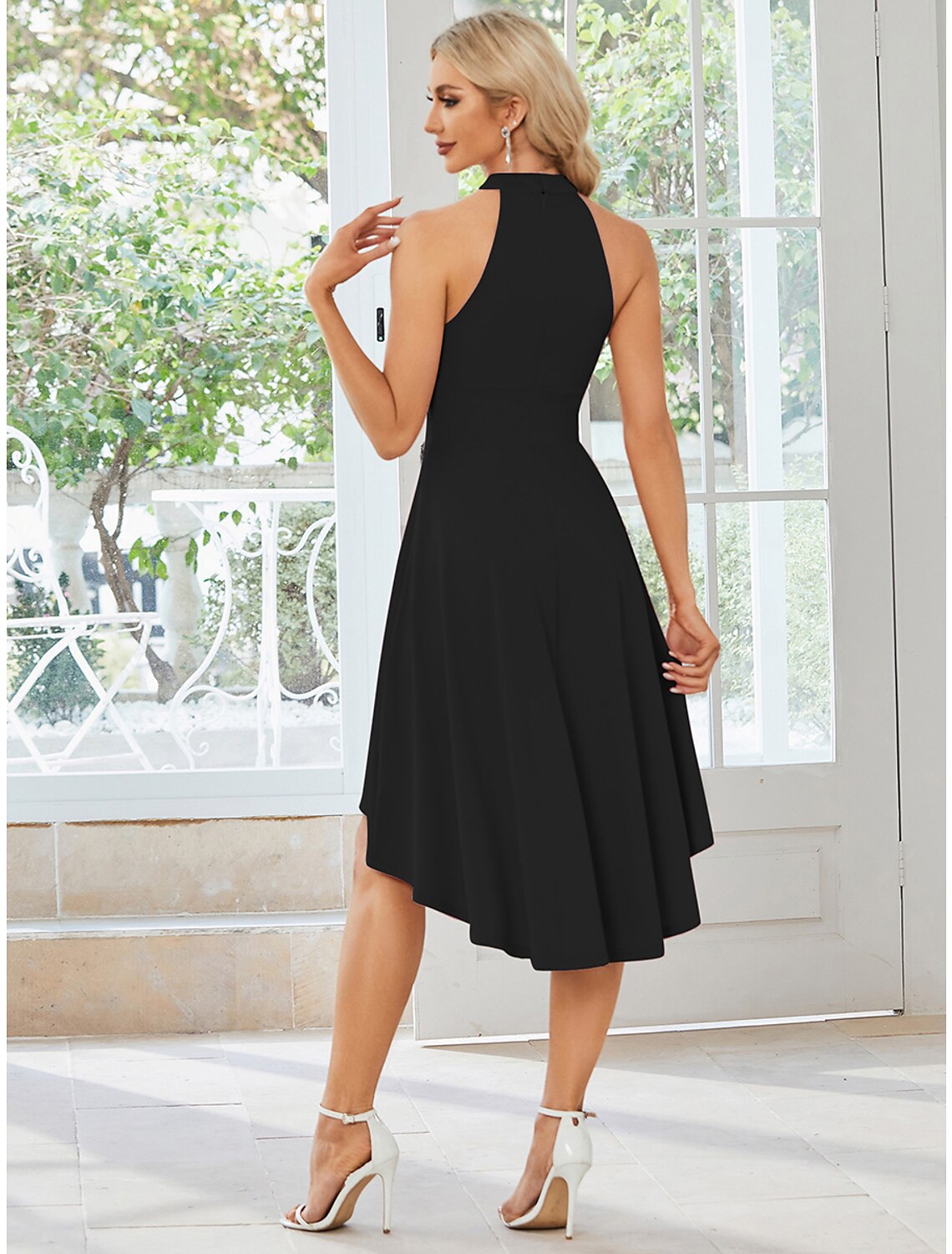 Full length view of the A-line wedding guest dress.