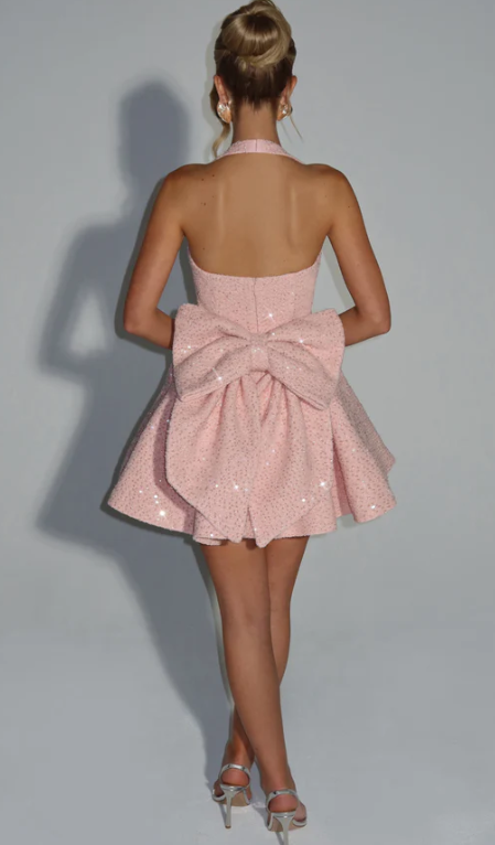 Side view of the A-line halter dress, highlighting its silhouette.
