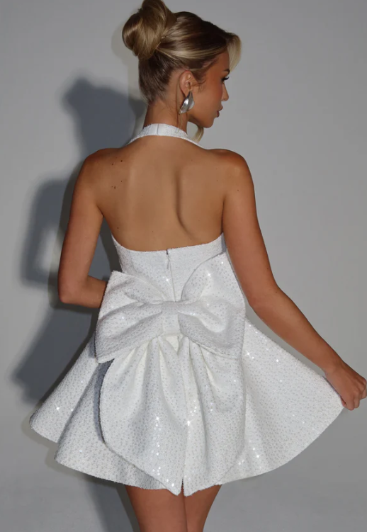 Detail of the halter neckline and fabric of the elegant dress.