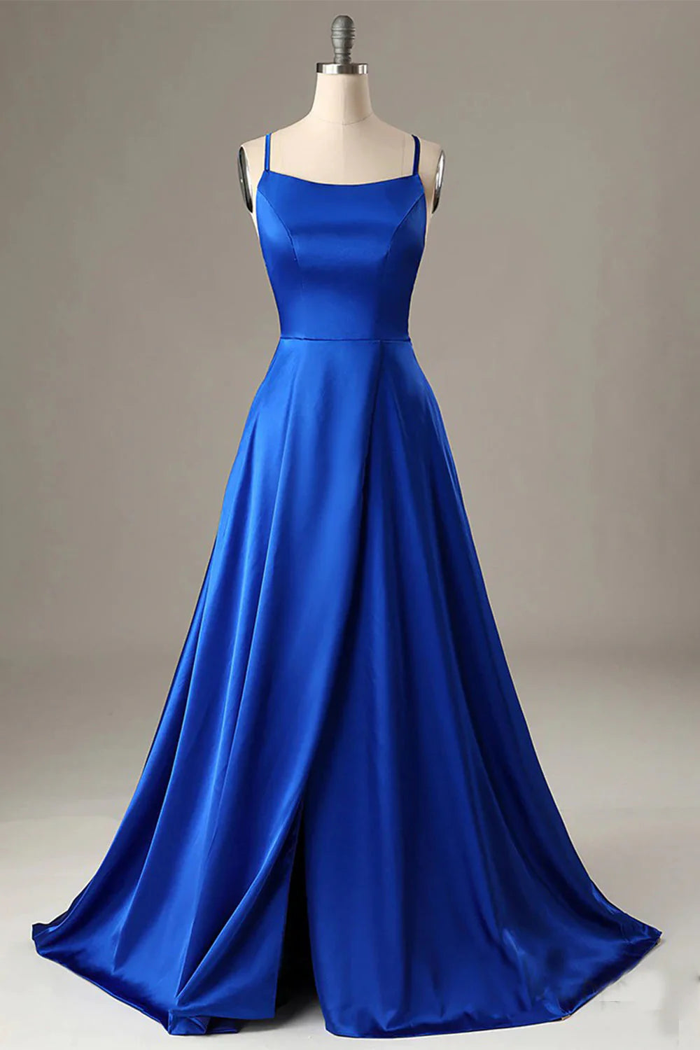 Front view of an elegant royal blue A-line halter backless prom dress.