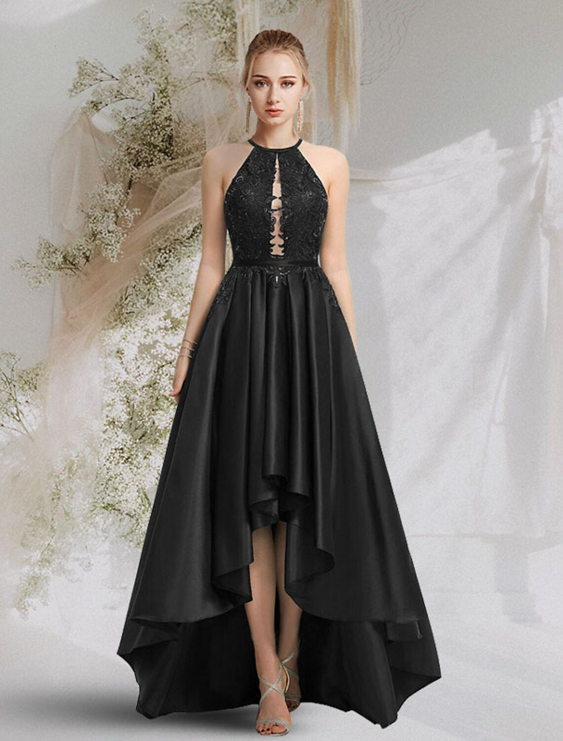 A-line halter backless satin prom dress with lace inserts and cut-outs.