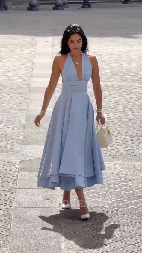 Elegant A-line blue formal dress with halter deep V neckline and backless design.
