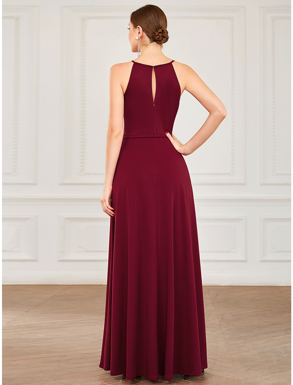 Close-up of halter neckline and draped detail on prom dress.