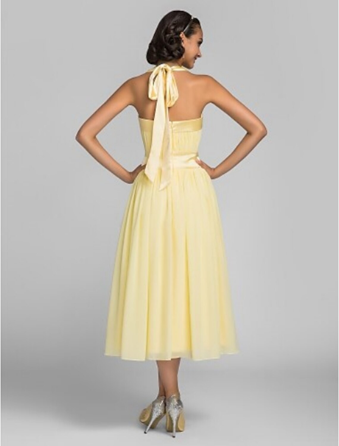 Back view of the A-line halter tea length bridesmaid dress.