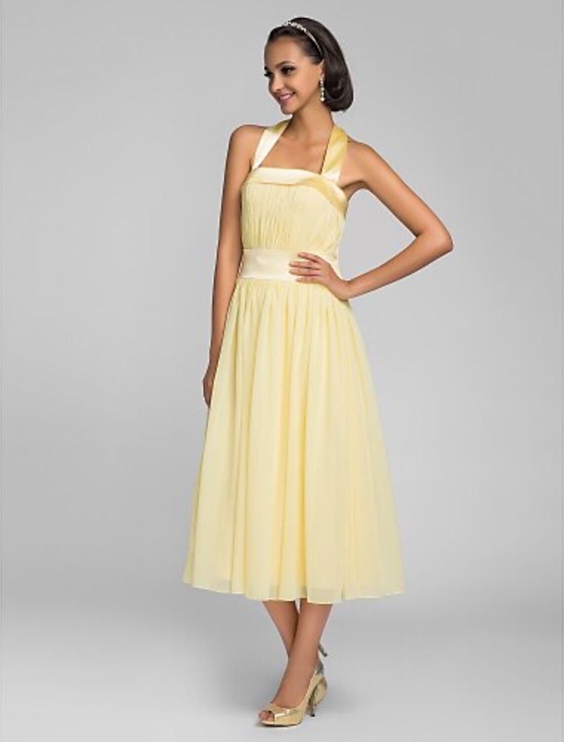 Full length view of the elegant tea length bridesmaid gown.