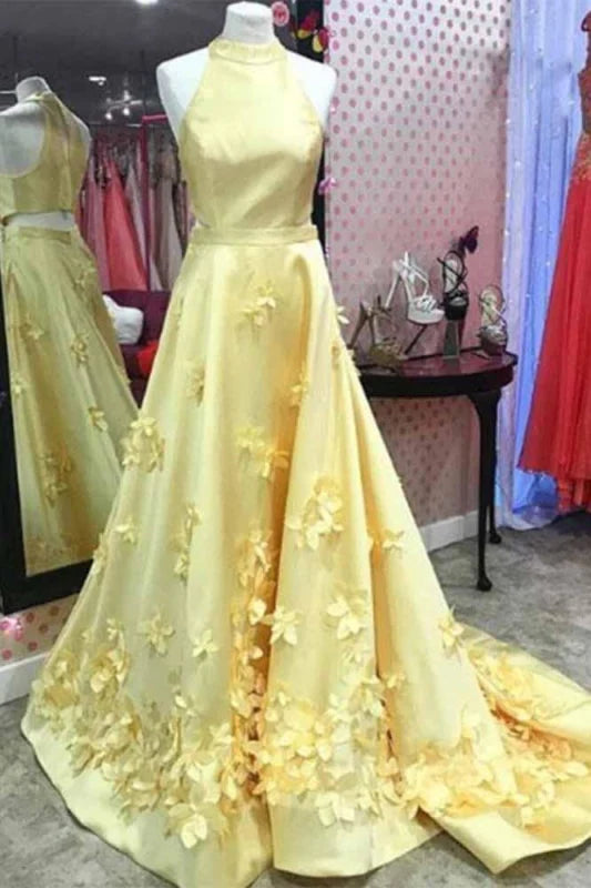 Elegant A-line halter neck prom dress with floral appliques and a sweep train.