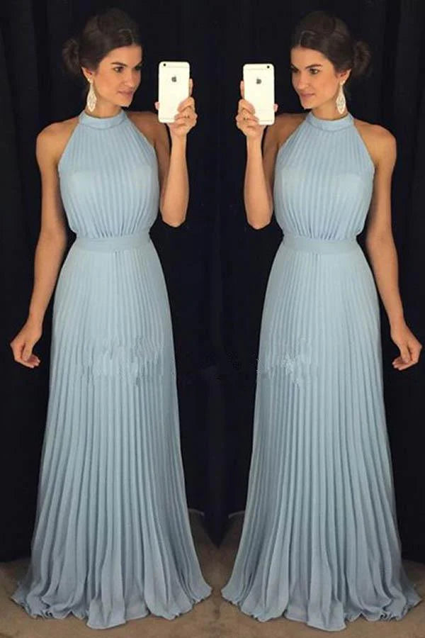Woman wearing a dusty blue halter high neck A-line long prom dress.