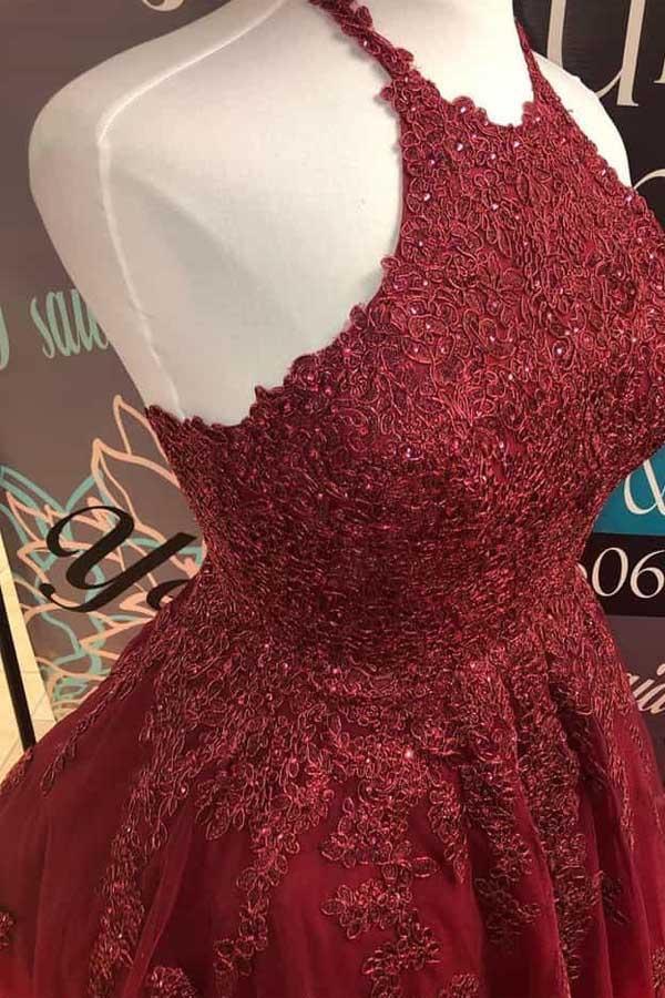 Burgundy A-line halter dress with lace details and backless design.