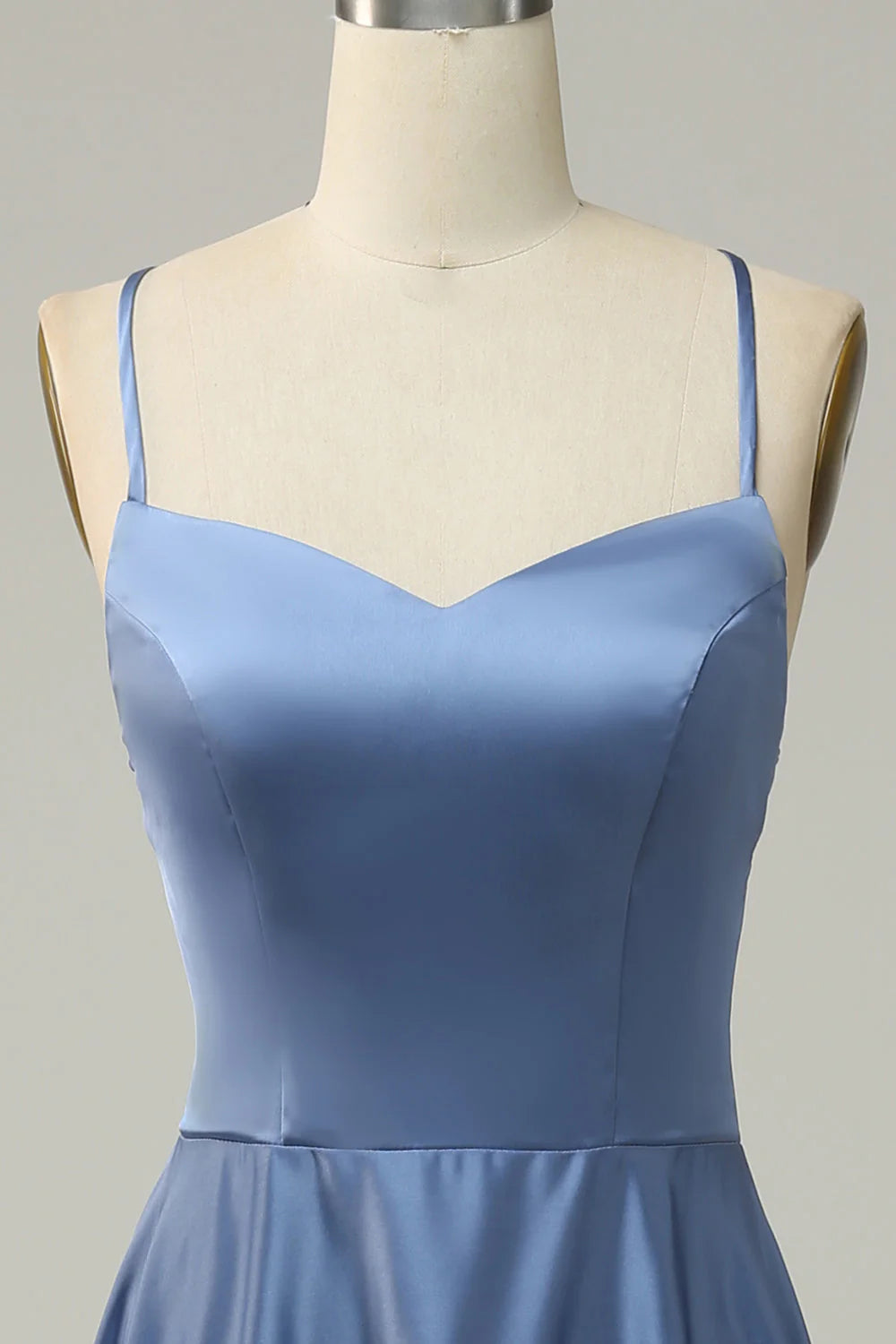 Full length view of the flowing blue A-line halter dress.