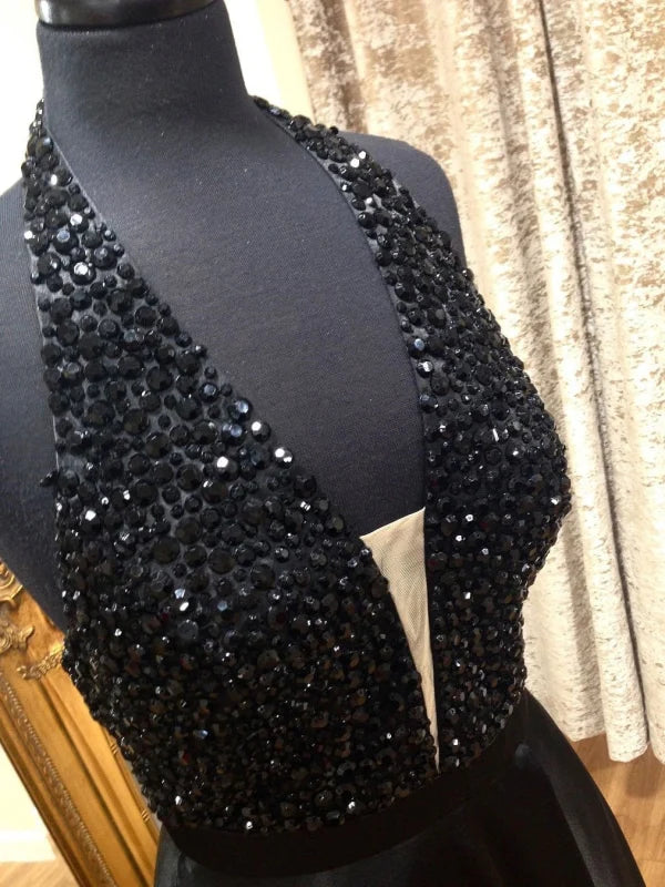 Back view of A-line halter neck beaded formal gown.