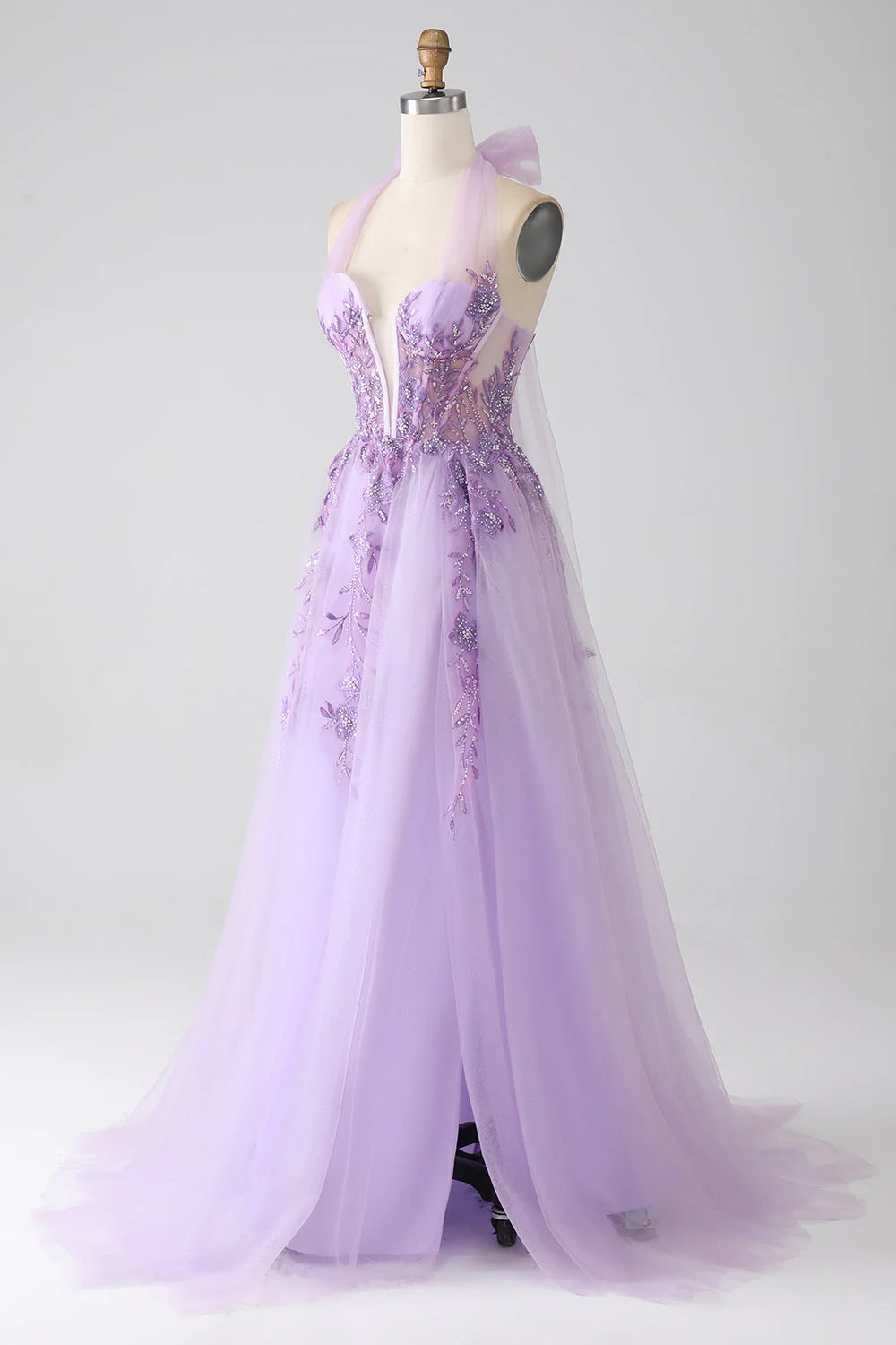 Close-up of the intricate beading on the halter neck prom dress.