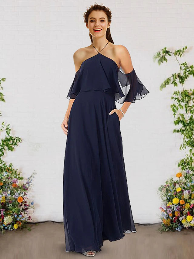 Close-up of the halter neckline and ruffled detail on the chiffon dress.